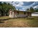 Charming single-story home featuring a well-maintained lawn, and a welcoming front entrance at 6423 Bass Rd, Weeki Wachee, FL 34607