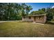 Charming single-story home with a well-kept lawn near the road, and a welcoming front entrance at 6423 Bass Rd, Weeki Wachee, FL 34607
