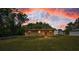 Charming single-story home featuring a well-maintained lawn, and a welcoming front entrance at 6423 Bass Rd, Weeki Wachee, FL 34607