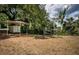 Outdoor space featuring a shelter, storage unit, waterway, and antenna at 6423 Bass Rd, Weeki Wachee, FL 34607