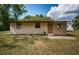 Charming single-story home featuring a well-maintained lawn, and a welcoming front entrance at 6423 Bass Rd, Weeki Wachee, FL 34607