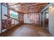 Under construction room features exposed insulation and sliding glass doors at 6423 Bass Rd, Weeki Wachee, FL 34607