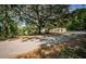 View of the street and property featuring a dwelling, a structure, and trees at 6423 Bass Rd, Weeki Wachee, FL 34607