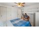 Cozy bedroom featuring a bed, closet, and natural light from the doorway at 6424 Ponder Dr, Port Richey, FL 34668