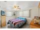Relaxing bedroom with a ceiling fan and ample natural light from multiple windows at 6424 Ponder Dr, Port Richey, FL 34668