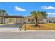 Charming home with mature palm trees, carport, and well-maintained lawn is a perfect welcome at 6424 Ponder Dr, Port Richey, FL 34668