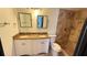 Bathroom featuring double sinks and a tiled shower at 7017 Baywood Dr, Tampa, FL 33637