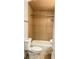 Cozy bathroom with toilet, shower, and tan tile walls at 7017 Baywood Dr, Tampa, FL 33637