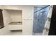 Modern bathroom featuring a tiled shower, updated fixtures, and a granite vanity at 7017 Baywood Dr, Tampa, FL 33637