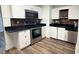 Updated kitchen with stainless steel appliances, sleek countertops, and modern backsplash at 7017 Baywood Dr, Tampa, FL 33637