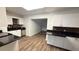 Modern kitchen featuring white cabinets, black countertops, and stainless steel appliances at 7017 Baywood Dr, Tampa, FL 33637