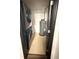 Enclosed laundry room with washer, dryer, and hot water heater at 7017 Baywood Dr, Tampa, FL 33637