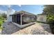 Covered patio with brick pavers and screen enclosure at 7017 Baywood Dr, Tampa, FL 33637