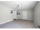 Large bedroom with a ceiling fan and multiple doors offering ample space and natural light at 7211 & 0 Sunnyside Dr, Brooksville, FL 34601