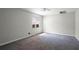 Spacious bedroom featuring a ceiling fan, window, and neutral-colored walls and carpet at 7211 & 0 Sunnyside Dr, Brooksville, FL 34601