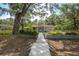 Charming single story home with landscaped front yard, inviting entryway and mature shady trees at 7211 & 0 Sunnyside Dr, Brooksville, FL 34601