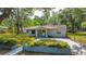 Charming single-story home with a well-kept lawn and a defined flower bed enhancing curb appeal at 7211 & 0 Sunnyside Dr, Brooksville, FL 34601