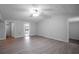 Spacious living room with light walls and floors and ceiling fan at 7211 & 0 Sunnyside Dr, Brooksville, FL 34601
