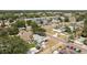 Neighborhood aerial view featuring a cozy home with a spacious yard and mature trees at 7494 7Th N St, St Petersburg, FL 33702