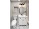 This is a charming bathroom featuring light tile, modern vanity, and black hardware at 7494 7Th N St, St Petersburg, FL 33702