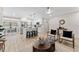 Open-concept living and dining room with an island kitchen, stainless appliances, and plenty of seating at 7494 7Th N St, St Petersburg, FL 33702