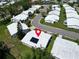 An aerial view of a neighborhood showcasing single-story homes, lush landscaping, and a calm, suburban atmosphere at 9136 42Nd N Ln, Pinellas Park, FL 33782