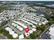 An aerial view of a quiet neighborhood near a beautiful lake and local area amenities at 9136 42Nd N Ln, Pinellas Park, FL 33782