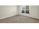 Small bedroom featuring a bright window and carpet at 9136 42Nd N Ln, Pinellas Park, FL 33782