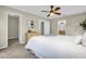 Bedroom features light colored walls, carpet, and a ceiling fan with several doorways leading to various rooms at 9136 42Nd N Ln, Pinellas Park, FL 33782