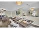 Dining room with modern decor, hardwood floors, and living room in the background at 9136 42Nd N Ln, Pinellas Park, FL 33782
