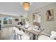 Bright dining room featuring a chandelier and an open layout to the kitchen and living room at 9136 42Nd N Ln, Pinellas Park, FL 33782