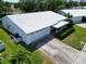 A charming single-story home with a well-maintained lawn and concrete driveway leading to an attached garage at 9136 42Nd N Ln, Pinellas Park, FL 33782
