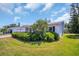 Exterior view shows a home with a well-maintained lawn and landscaping at 9136 42Nd N Ln, Pinellas Park, FL 33782