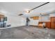 Spacious garage with painted concrete floors, overhead lighting, and storage at 9136 42Nd N Ln, Pinellas Park, FL 33782