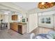 Bright kitchen featuring granite countertops and access to a sunroom at 9136 42Nd N Ln, Pinellas Park, FL 33782