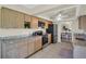 Efficient kitchen featuring stainless steel appliances, tiled floors, and wood cabinetry at 9136 42Nd N Ln, Pinellas Park, FL 33782