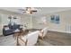 Cozy living room featuring stylish decor, hardwood floors, and a large window at 9136 42Nd N Ln, Pinellas Park, FL 33782