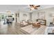 Bright and airy living room featuring modern decor and hardwood floors at 9136 42Nd N Ln, Pinellas Park, FL 33782