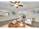 Living room with modern decor, hardwood floors, and a dining area in the background at 9136 42Nd N Ln, Pinellas Park, FL 33782