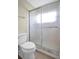 Bathroom walk-in shower with glass sliding doors, and toilet at 9136 42Nd N Ln, Pinellas Park, FL 33782