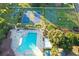 Aerial view of community amenities: pool, tennis courts, basketball court, playground, and green space at 923 Tuscanny St, Brandon, FL 33511