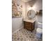 Charming bathroom features a vanity with granite countertop, stylish fixtures, and neutral wall paint at 923 Tuscanny St, Brandon, FL 33511