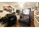 Fun, space-themed bedroom with a large screen TV, desk, and space-themed bedding at 923 Tuscanny St, Brandon, FL 33511