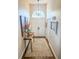 Inviting foyer featuring a high ceiling, chandelier, decorative table, and double doors at 923 Tuscanny St, Brandon, FL 33511