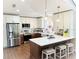 Bright kitchen featuring white cabinets, stainless steel appliances, a breakfast bar, and pendant lighting at 923 Tuscanny St, Brandon, FL 33511