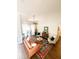 Bright and airy living room with wood floors, a ceiling fan, and a cozy seating area at 923 Tuscanny St, Brandon, FL 33511