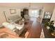 Comfortable living room featuring wood floors, large windows, and stylish furnishings for relaxation at 923 Tuscanny St, Brandon, FL 33511
