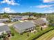 Aerial view of home shows backyard patio, landscaping, and neighboring houses in a serene community at 9335 Stonewall, New Port Richey, FL 34655