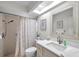 Bright bathroom featuring vanity, framed mirror, modern fixtures, and shower at 9335 Stonewall, New Port Richey, FL 34655