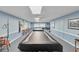 An expansive billiards room with multiple tables, offering a space for recreation and leisure at 9335 Stonewall, New Port Richey, FL 34655